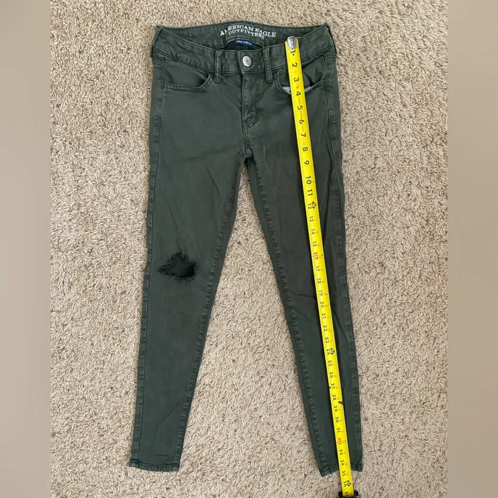 American Eagle Distressed Green Jeggings size 2